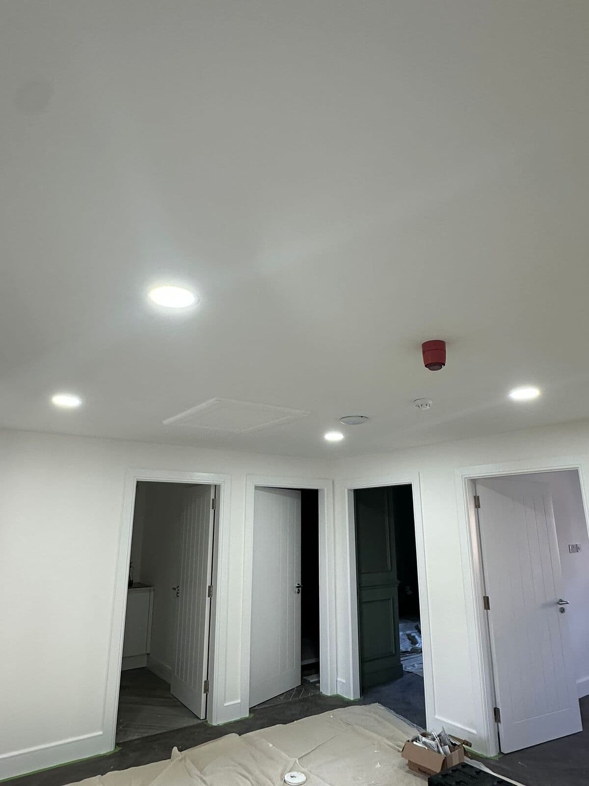 LED downlights fitted in a bright commercial corridor