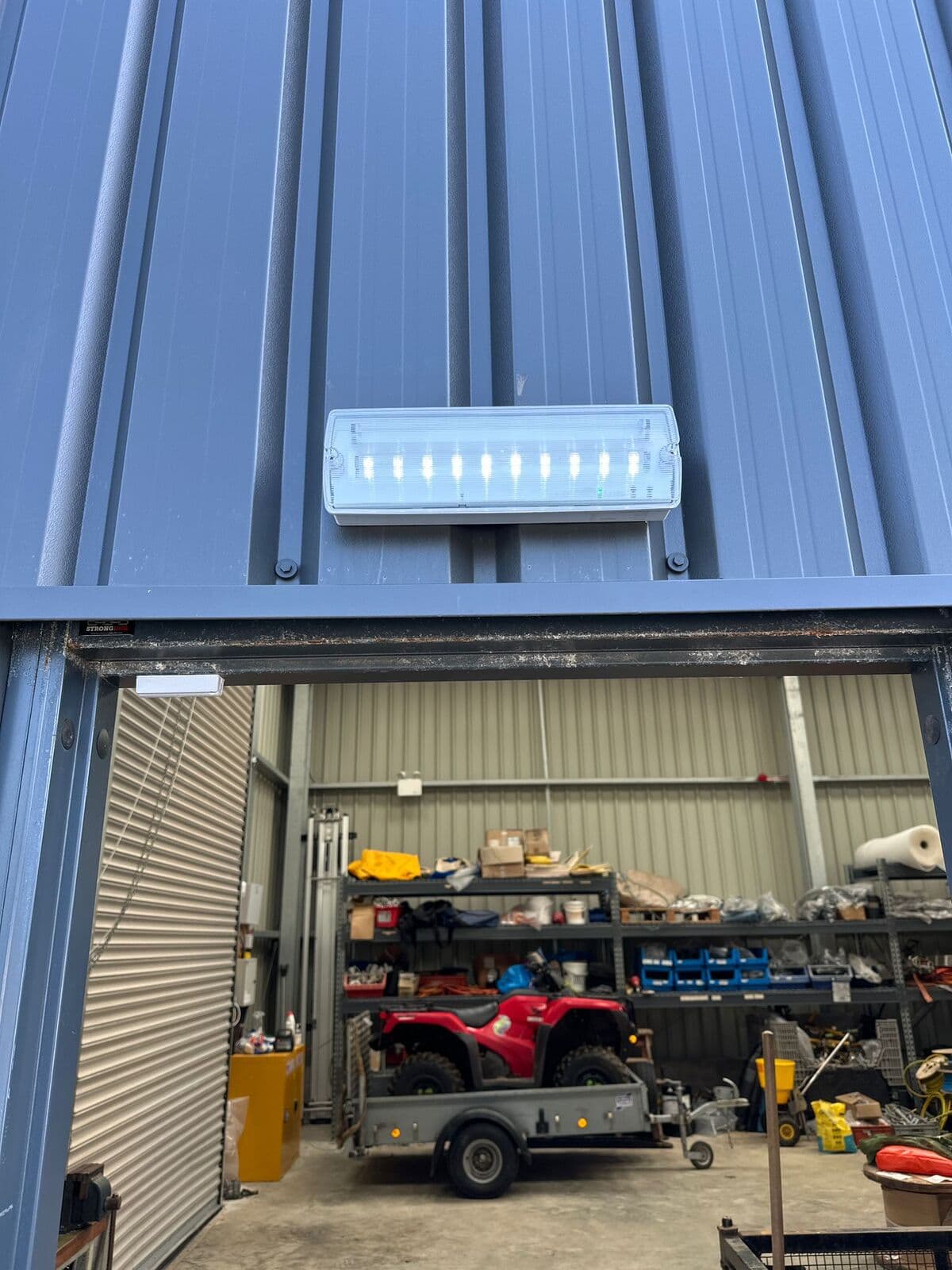 Emergency light above the shutter door of an industrial unit