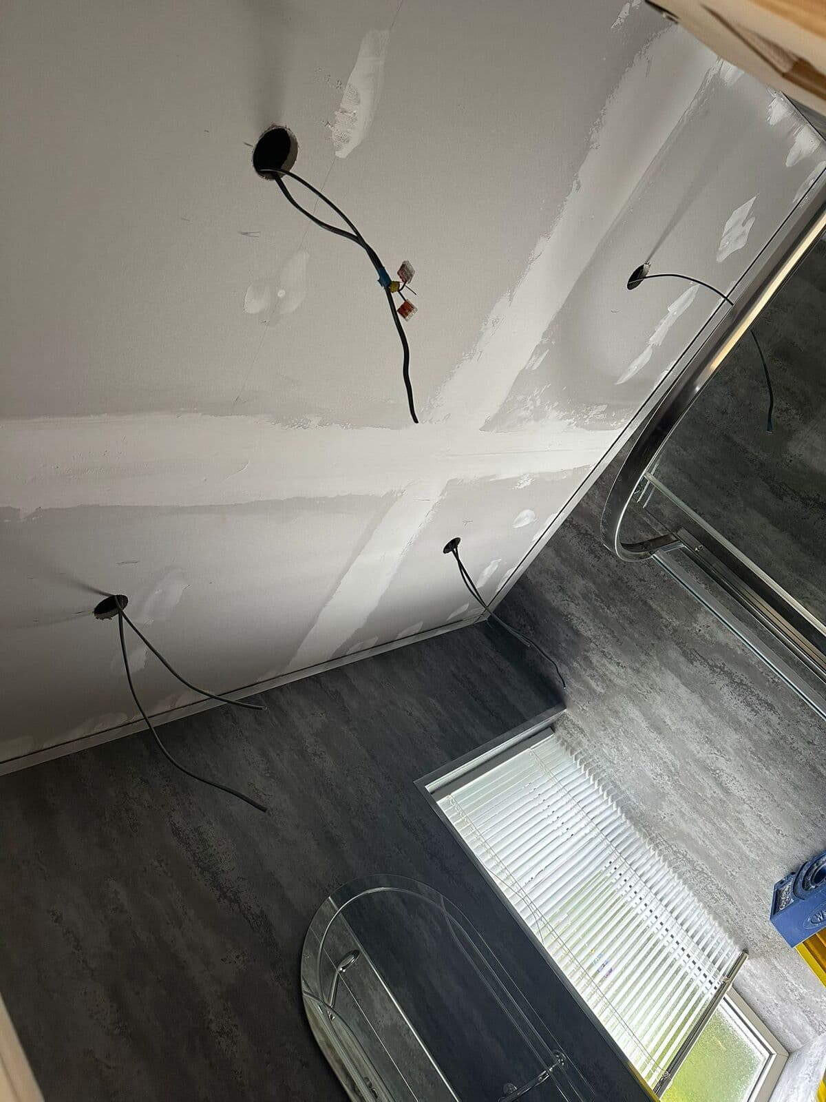 New cables ready at the ceiling points during a rewire