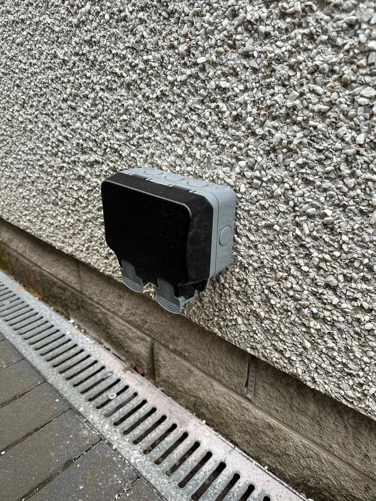 Outside socket with its weatherproof cover closed
